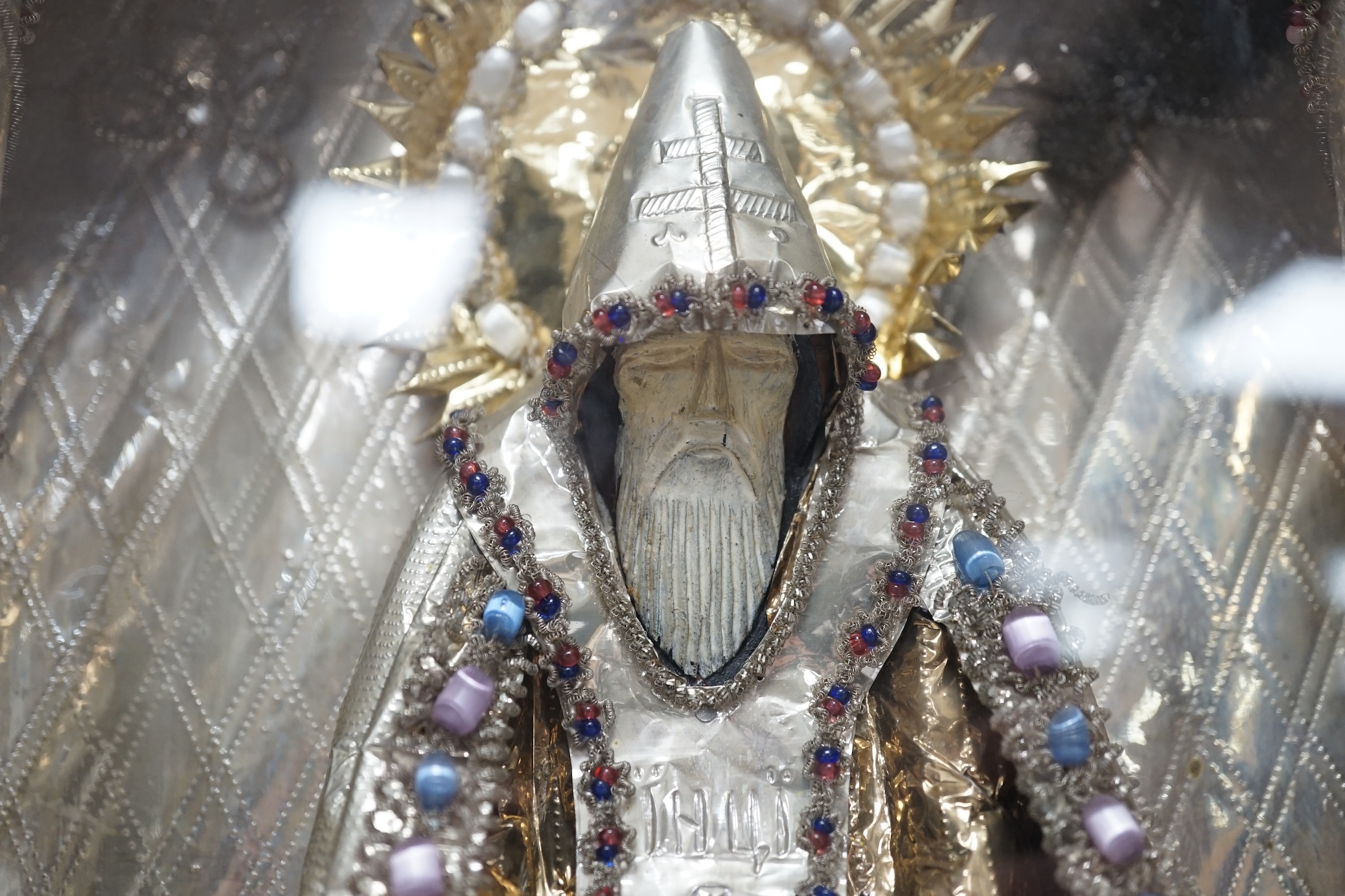 A Russian icon / figurative diorama, ‘Old Believers’, decorated with mixed metals and coloured beadwork, 33cm wide, 37cm high. Condition - case rubbed, good interior